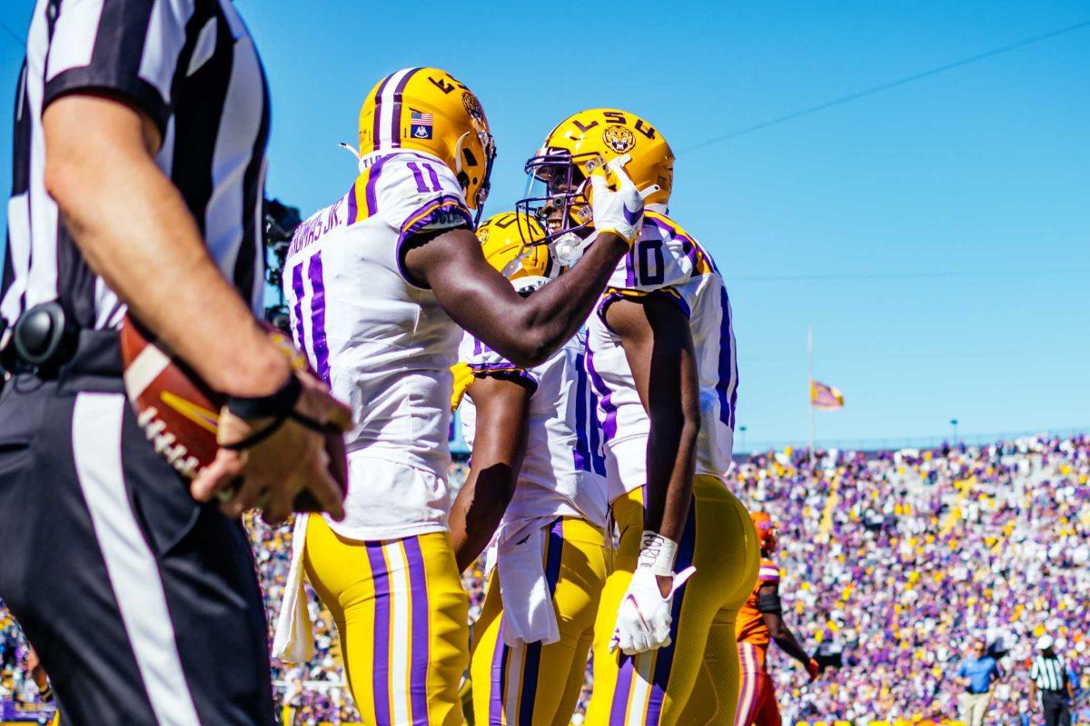 LSU football junior wide receiver Jaray Jenkins (10) celebrates his touchdown with freshman wide receiver Brian Thomas Jr. (11) Saturday, Oct. 16, 2021, during LSU's 49-42 win against Florida at Tiger Stadium in Baton Rouge, La.