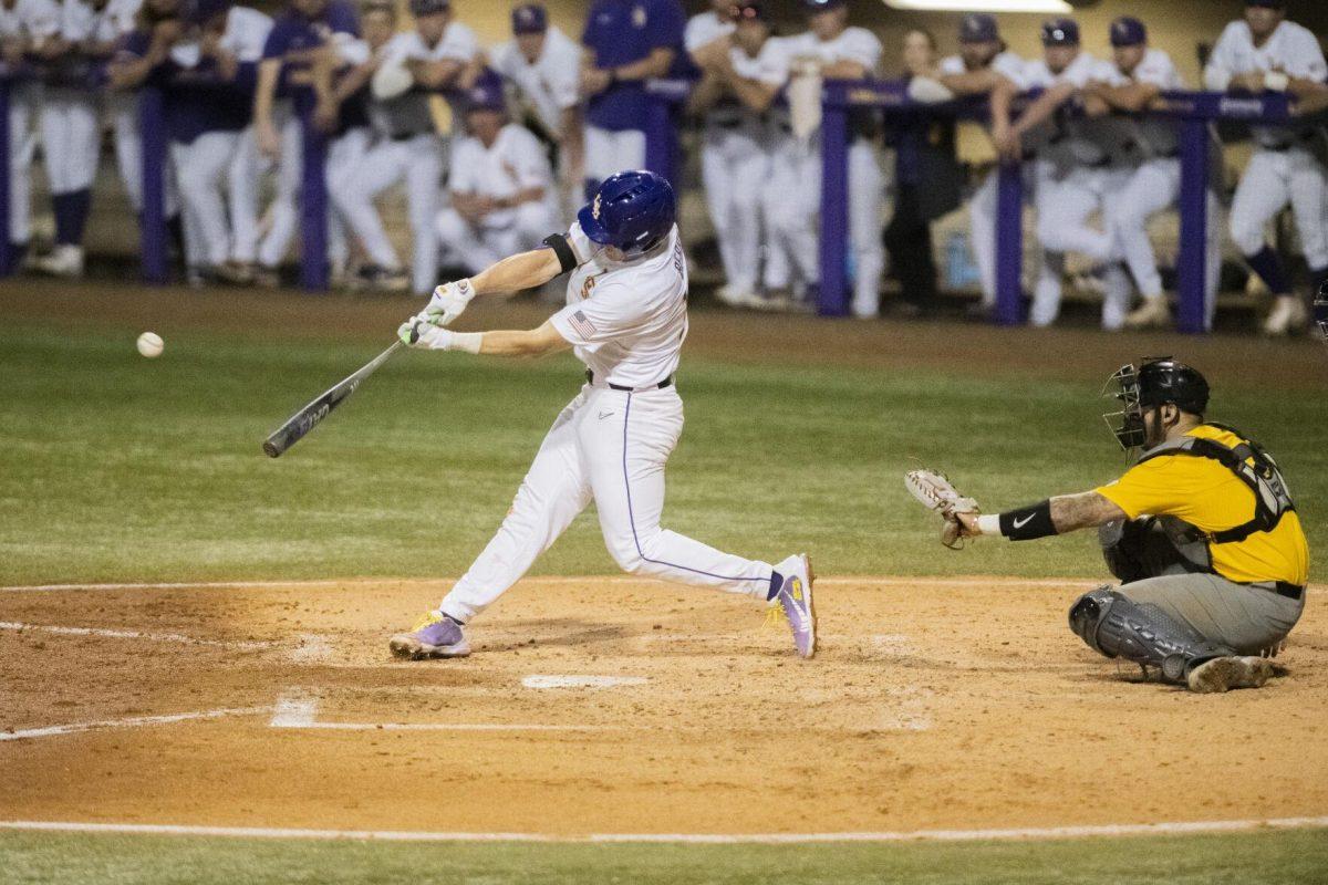 LSU baseball sophomore infield Jacob Berry (14) swings at the ball Thursday, April 21, 2022, during the game against the University of Missouri at Alex Box Stadium on Gourrier Avenue in Baton Rouge, Louisiana.