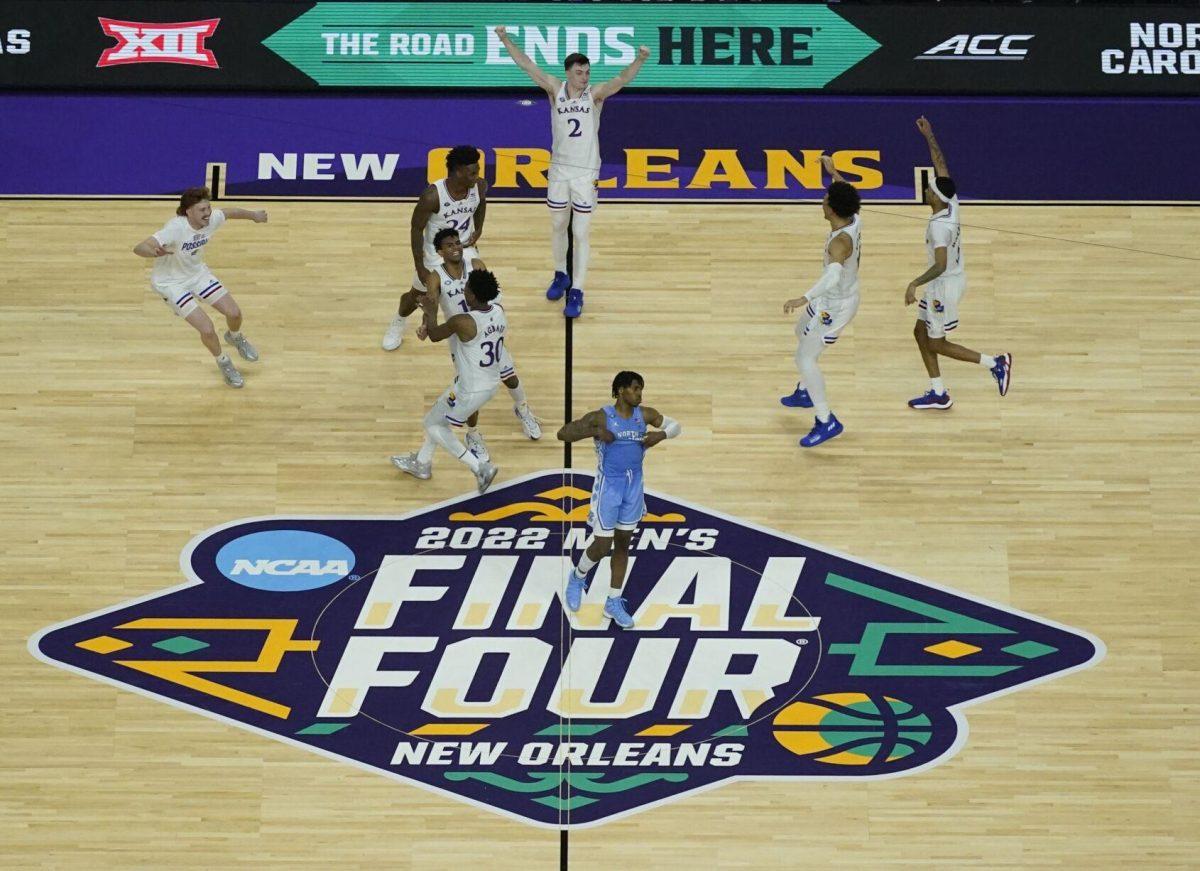 Kansas celebrates a victory over North Carolina during the second half of a college basketball game in the finals of the Men's Final Four NCAA tournament, Monday, April 4, 2022, in New Orleans. Kansas won 72-69. (AP Photo/David J. Phillip)