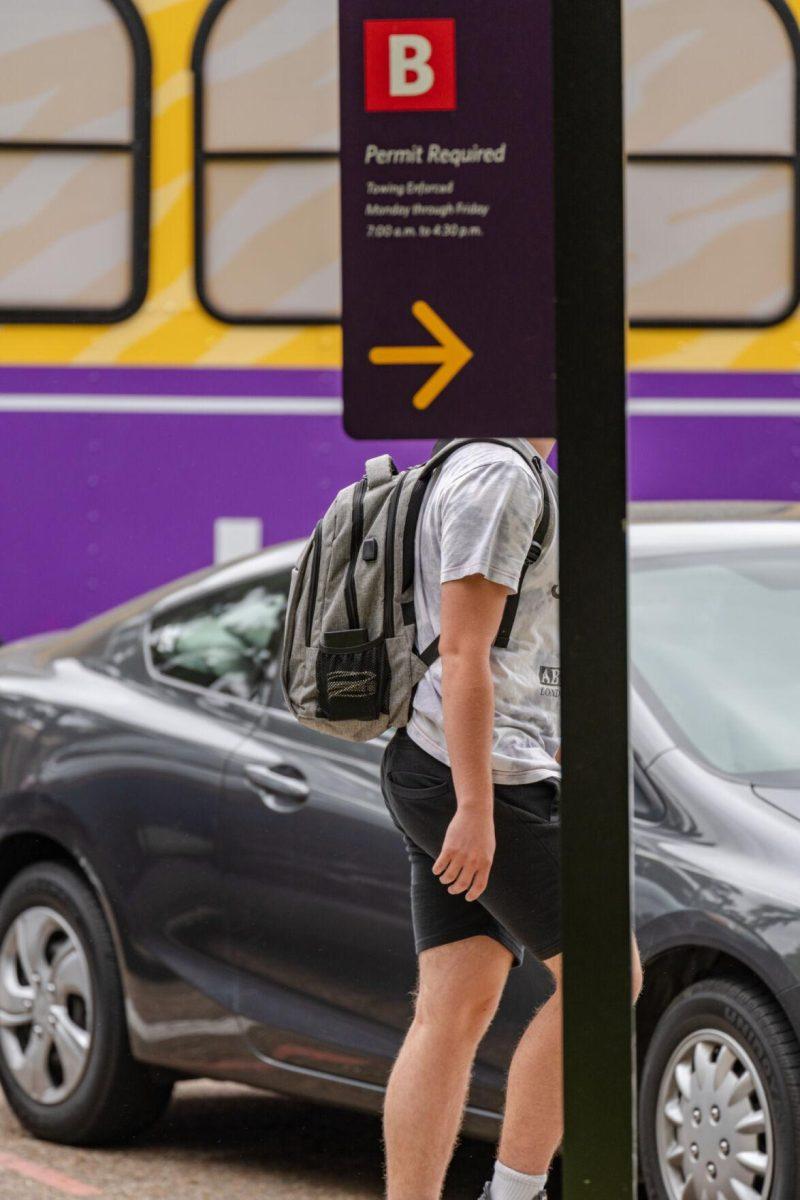 A parking sign conceals a student&#8217;s head on Tuesday, April 12, 2022, on Field House Drive in Baton Rouge, La.