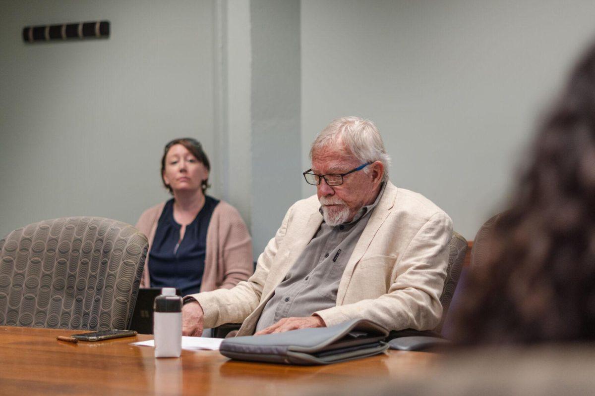 LSU Faculty Senate Member-at-Large Roger Laine looks at the agenda on Wednesday, April 20, 2022, during the LSU Faculty Senate Executive Committee meeting inside the LSU Student Union on Highland Road in Baton Rouge, La.