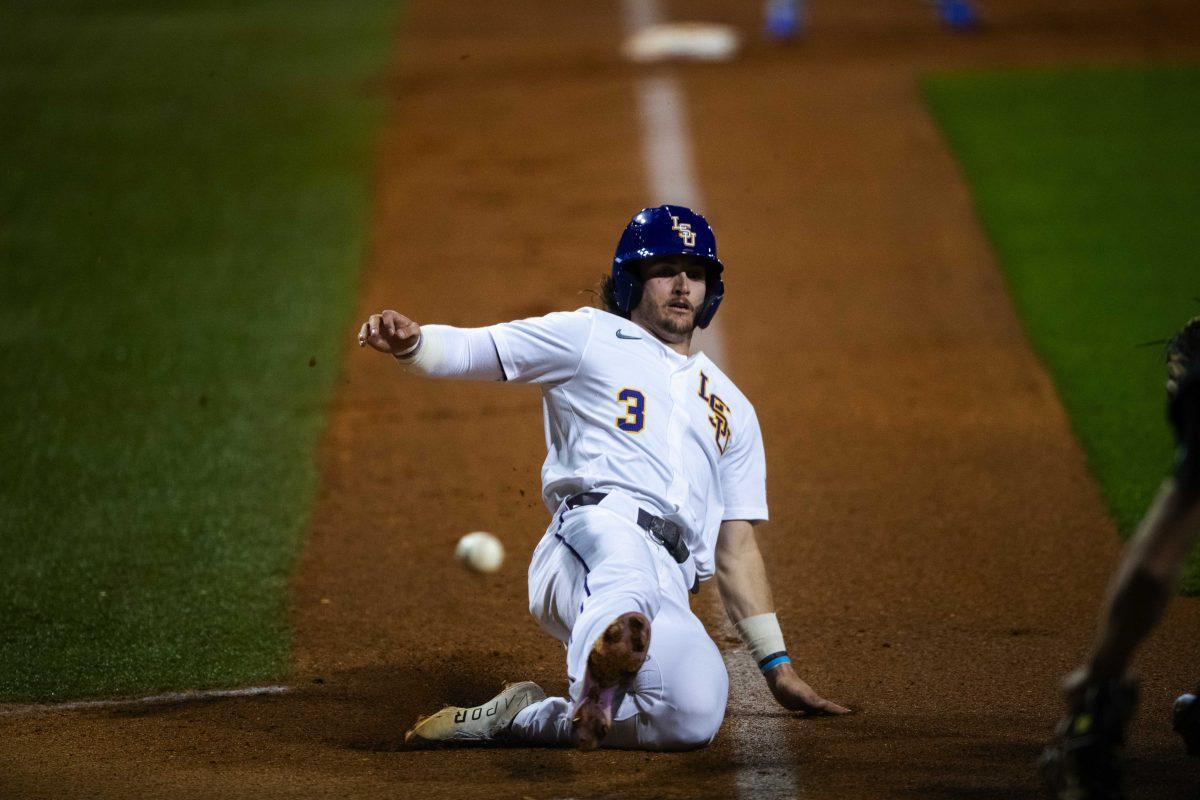 LSU baseball sophomore outfielder Dylan Crews (3) steals home Wednesday, March 2, 2022 before LSU's 11-3 win against UNO at Alex Box Stadium on Gourrier Avenue in Baton Rouge, La.