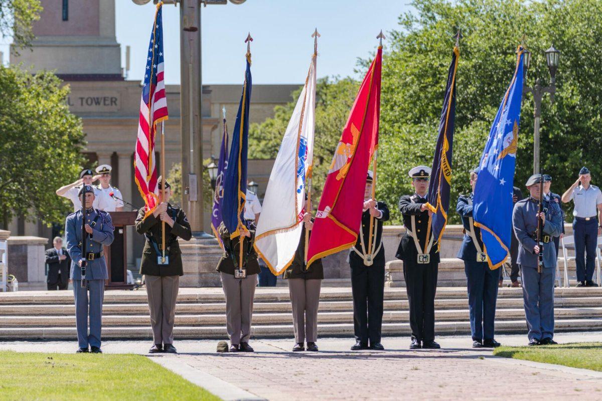 The color guard presents the colors on Thursday, April 7, 2022, as the change of command ceremony begins on the LSU Parade Ground on Highland Road in Baton Rouge, La.