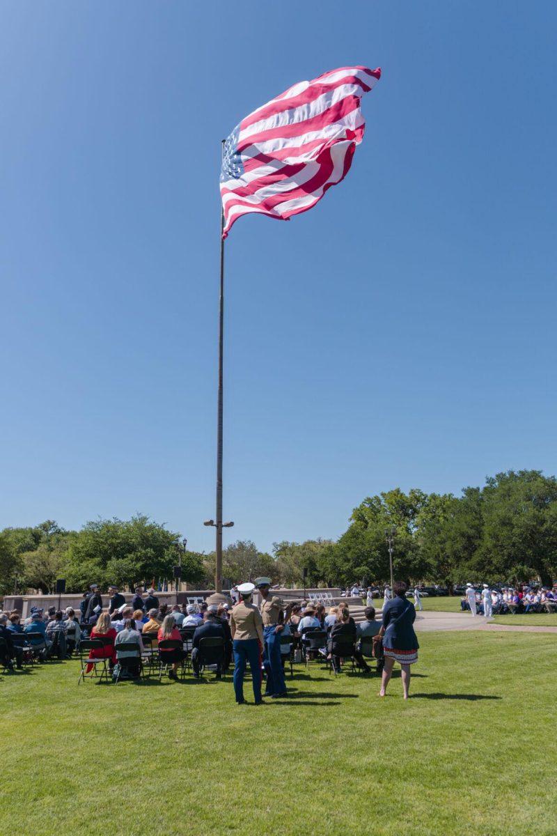 The American flag waves in the wind on Thursday, April 7, 2022, as the change of command ceremony begins on the LSU Parade Ground on Highland Road in Baton Rouge, La.