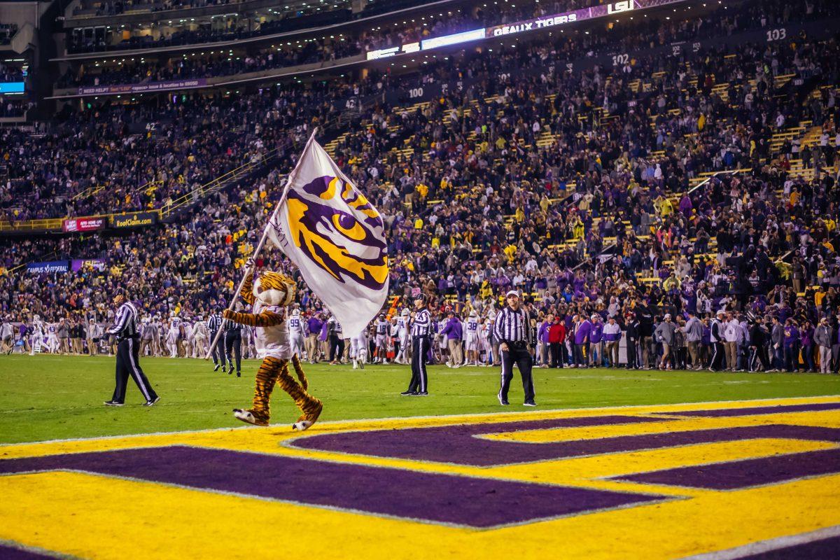 LSU football mascot Mike the Tiger waves a tiger eye flag Saturday, Nov. 27, 2021, during LSU's 27-24 win against Texas A&amp;M at Tiger Stadium in Baton Rouge, La.