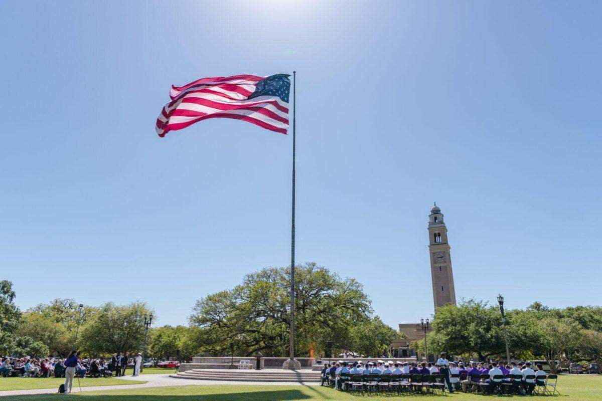 The American flag waves in the wind on Thursday, April 7, 2022, as the change of command ceremony begins on the LSU Parade Ground on Highland Road in Baton Rouge, La.