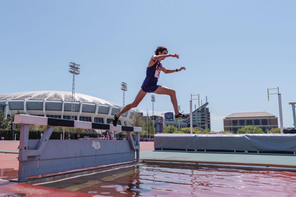 LSU track and field distance sophomore Davis Bove pushes off the barrier on Saturday, April 2, 2022, during the 3000m steeplechase at the Battle on the Bayou track meet at Bernie Moore Stadium in Baton Rouge, La.