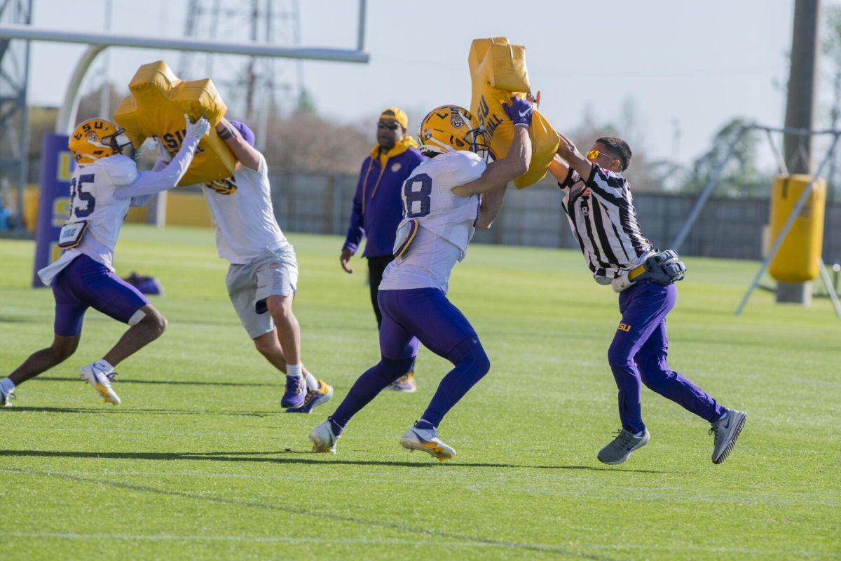 LSU football wide receivers LJ Gilyot (85) and Evan Francioni (88) run a drill Thursday, April 7, 2022, during LSU&#8217;s spring practice in Baton Rouge, Louisiana.