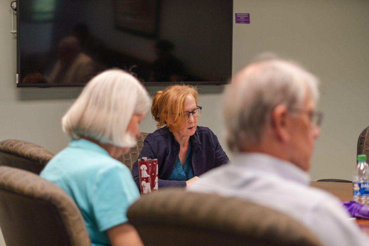 LSU Faculty Senate President Mandi Lopez looks at the meeting agenda on Wednesday, April 20, 2022, inside the LSU Student Union on Highland Road in Baton Rouge, La.