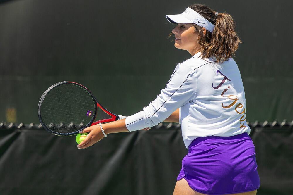 LSU women&#8217;s tennis freshman Rania Azziz prepares to serve the ball Friday, April 8, 2022, during LSU&#8217;s 7-0 loss against Texas A&amp;M in the LSU Tennis Complex on Gourrier Avenue in Baton Rouge.