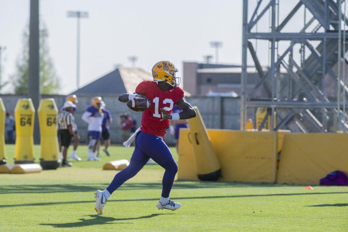 LSU football quarterback Tavion Faulk (12) prepares to throw the ball Thursday, April 7, 2022, during LSU&#8217;s spring practice in Baton Rouge, Louisiana.