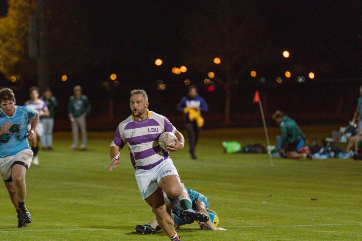 LSU Rugby flanker Hunter McCraine barrels down the pitch on Friday, April 8, 2022, during LSU&#8217;s 89-0 win over Tulane at the UREC Fields on Gourrier Avenue in Baton Rouge, La.