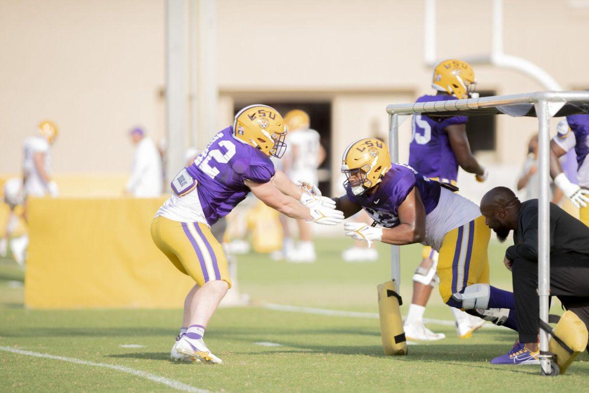 LSU football defensive tackle lane Blue (42) and defensive line Mekhi Wingo (92) practice defense Thursday, April 21, 2022, during LSU&#8217;s spring practice in Baton Rouge, Louisiana.