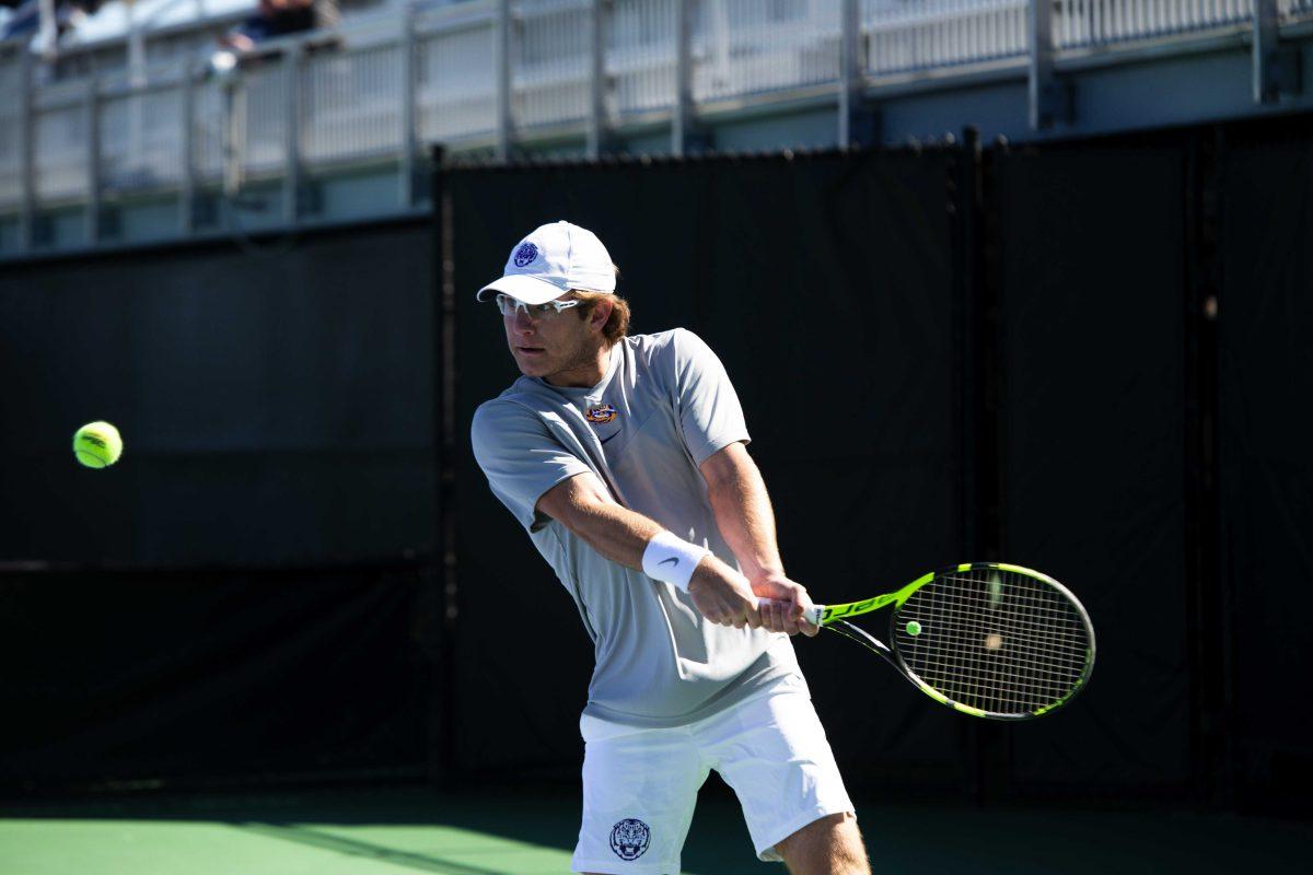 LSU men's tennis junior Nick Watson prepares to hit the ball Sunday, Feb. 13, 2021 during LSU's 6-1 win over Purdue at the LSU Tennis Complex on Gourrier Avenue in Baton Rouge, La.