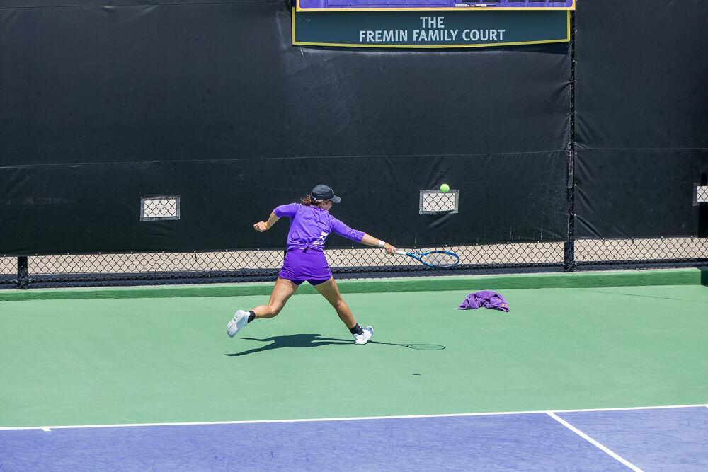 LSU women&#8217;s tennis junior Nina Geissler runs backward to hit a lob Friday, April 8, 2022, during LSU&#8217;s 7-0 loss against Texas A&amp;M in the LSU Tennis Complex on Gourrier Avenue in Baton Rouge.