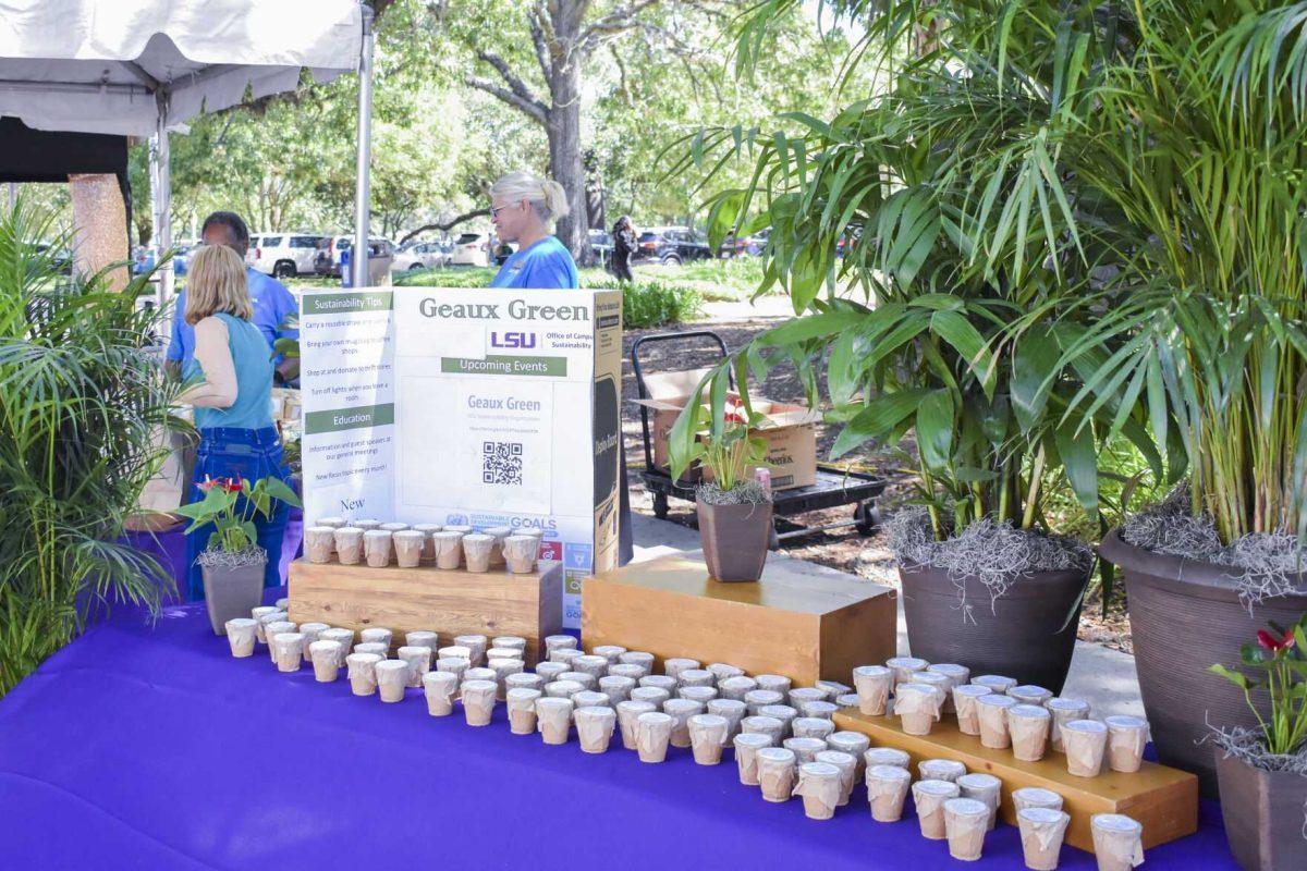 A &#8220;Geaux Green&#8221; posterboard sits on a table full of small pots of herbs Wednesday, April 27, 2022, during the Grateful for Spring event on Tower Drive in Baton Rouge, Louisiana.