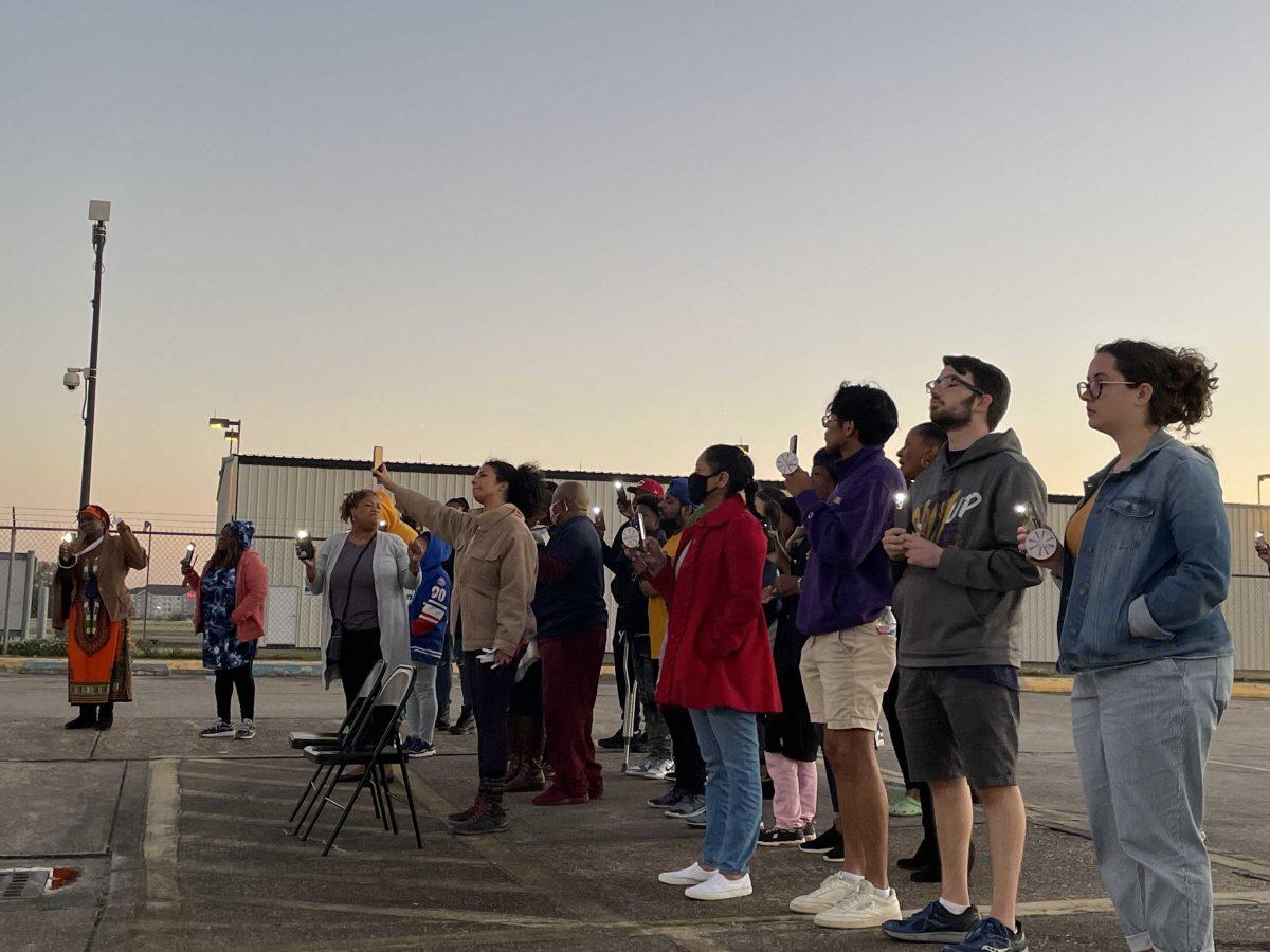 People gather in front of the EBR sheriff's office in protest to the killing of Deaughn Willis at a candlelight vigil.