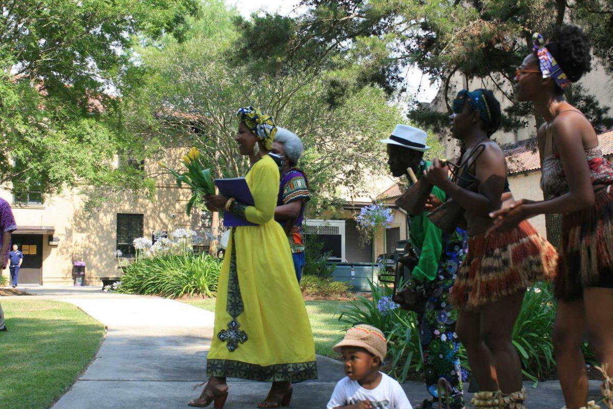 Professor of Social Work and organizer of the Libations Ceremony&#160;Dr. Cassandra Chaney steps forward to address the assembly on Wednesday, May 12, 2022.