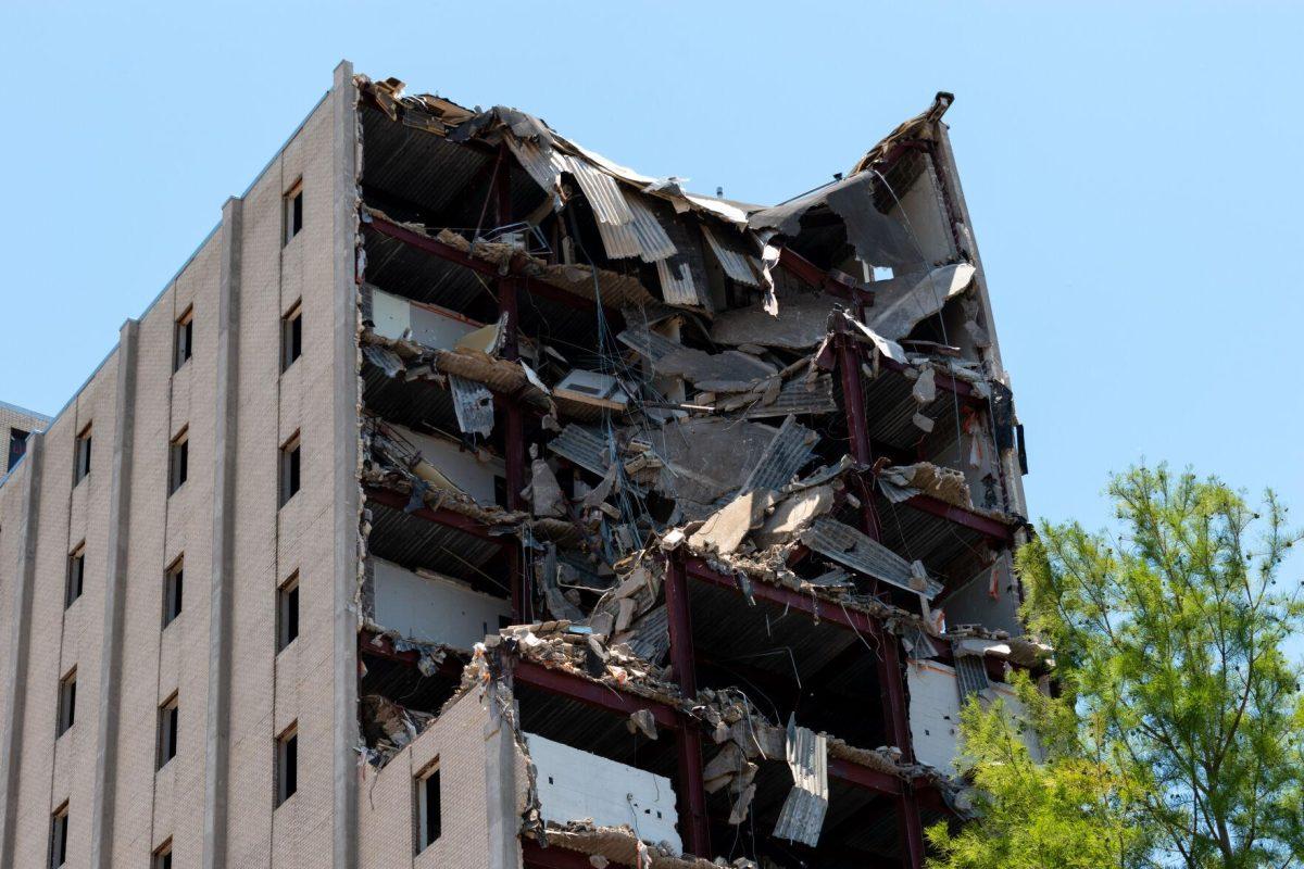 Rubble hangs off the demolished portion of Kirby Smith Hall on Thursday, May 26, 2022.