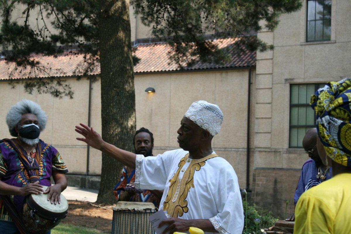 Former director of African and African American Studies Dr. Durant leads the libations, honoring and thanking the ancestors buried where he stands on Wednesday, May 12, 2022.