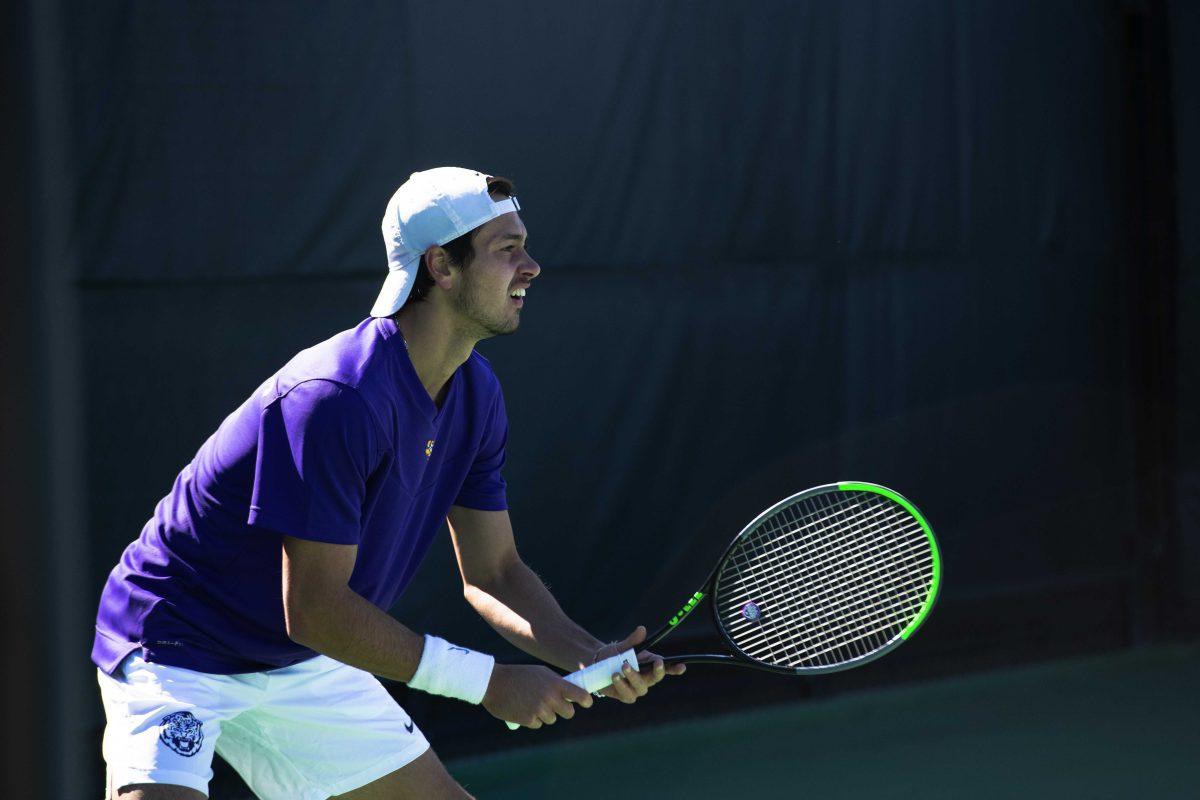 LSU men's tennis sophomore Benjamin Ambrosio focuses before the serve Sunday, Feb. 13, 2021 during LSU's 6-1 win over Purdue at the LSU Tennis Complex on Gourrier Avenue in Baton Rouge, La.