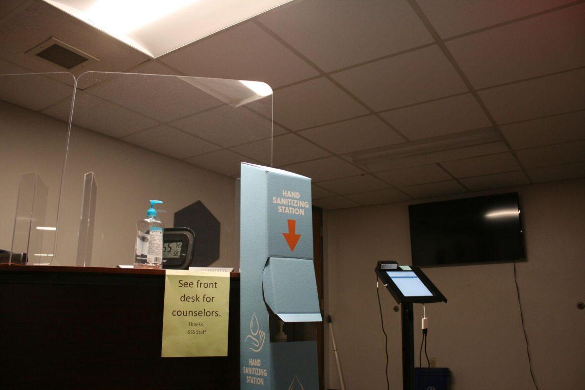 Sneeze guards and a hand sanitizing station ornament the welcome desk of the Student Support Services in the basement of Coats Hall on Monday, May 16, 2022.