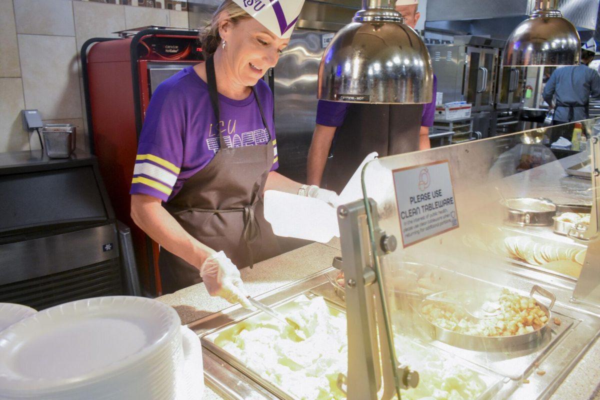 A Take 5 Dining Hall worker serves students breakfast Tuesday, May 3, 2022, for President&#8217;s Breakfast on LSU&#8217;s campus in Baton Rouge, Louisiana.