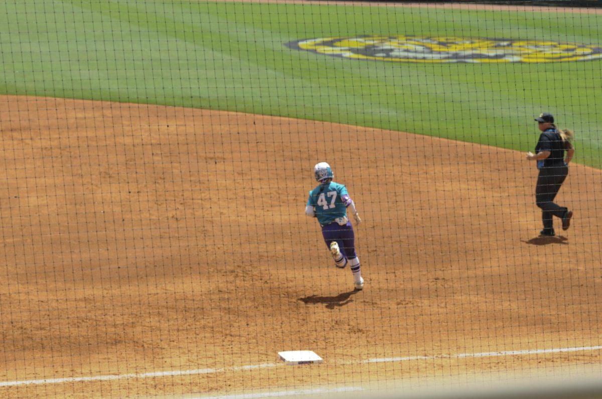 LSU freshman outfielder McKenzie Redoutey (4) runs the bases Saturday, April 30, 2022, during LSU&#8217;s 6-1 defeat against Florida at Tiger Park on Skip Bertman Drive in Baton Rouge, La.