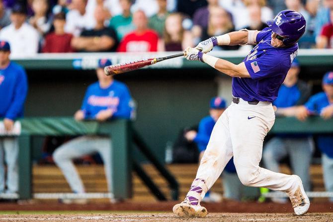 LSU junior catcher Michael Papierski (2) hits the ball down the third base line during the Tigers' 4-3 loss against the Gators on Monday June 26, 2017, at TD Ameritrade Park in Omaha, Nebraska.