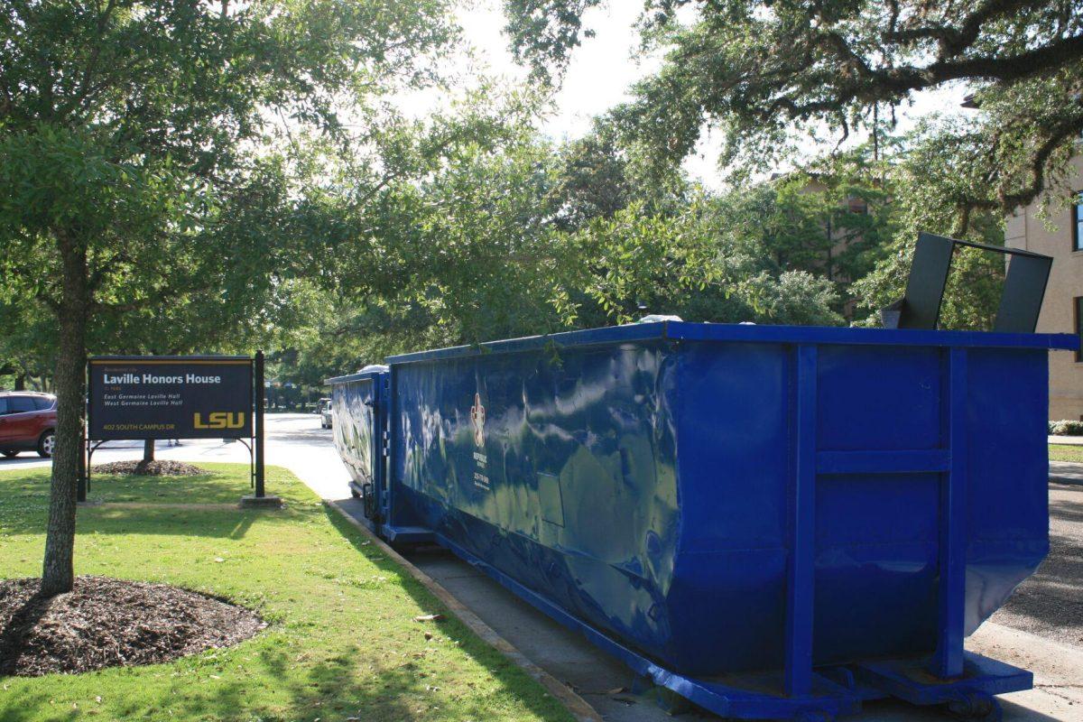 Two dumpsters sit outside the Laville Honors House on Monday, May 16, 2022.