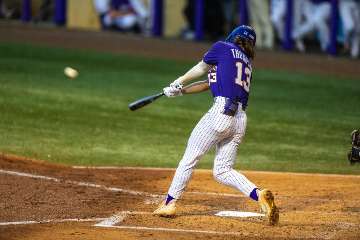 LSU baseball sophomore infield Jordan Thompson (13) hits the ball Tuesday, April 19, 2022, against University of Louisiana Lafayette at Alex Box Stadium on Gourrier Avenue in Baton Rouge, La.