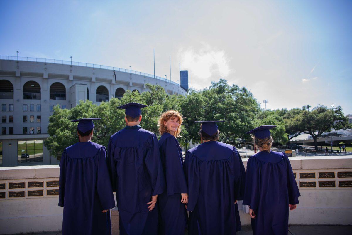 Editor-in-chief Lara Nicholson smiles while standing next to fellow editor graduates Wednesday, May 4, 2022, at LSU in Baton Rouge, La.&#160;