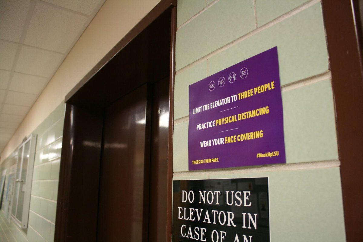 A limited capacity sign hangs outside the first floor elevator entrance of the Electrical Engineering Building on Wednesday, May 18, 2022.