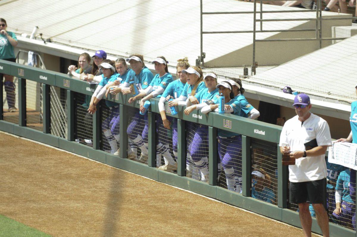 The LSU softball team watches and cheers from the dugout Saturday, April 30, 2022, during LSU&#8217;s 6-1 defeat against Florida at Tiger Park on Skip Bertman Drive in Baton Rouge, La.