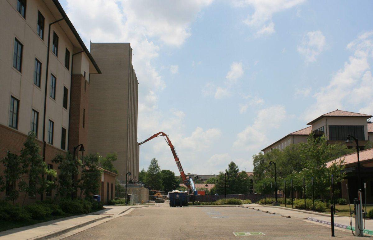 The arm of a crane reaches into Kirby Smith on Friday, May 20, 2022.