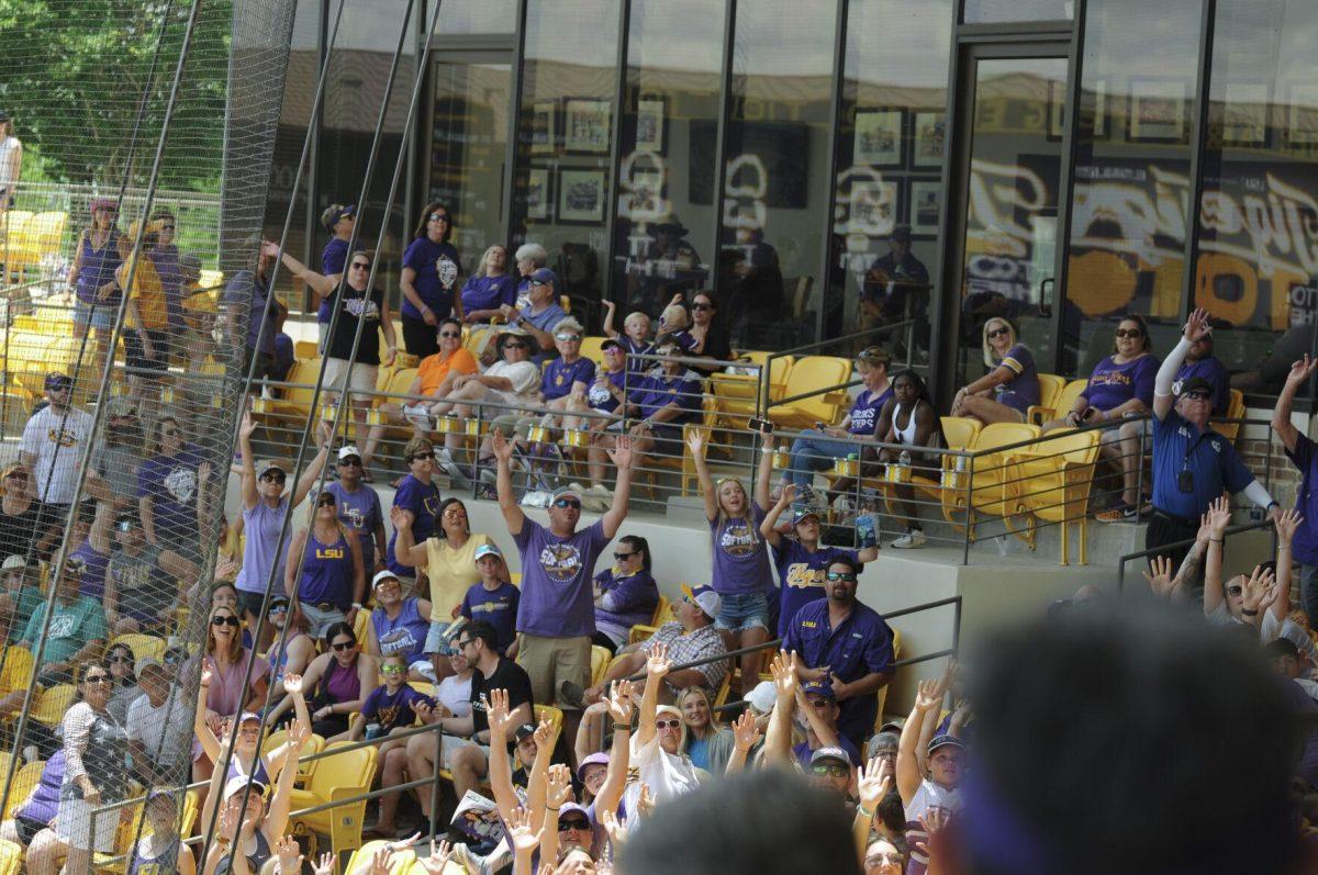 The crowd raises their hands for the t-shirt toss Saturday, April 30, 2022, during LSU&#8217;s 6-1 defeat against Florida at Tiger Park on Skip Bertman Drive in Baton Rouge, La.