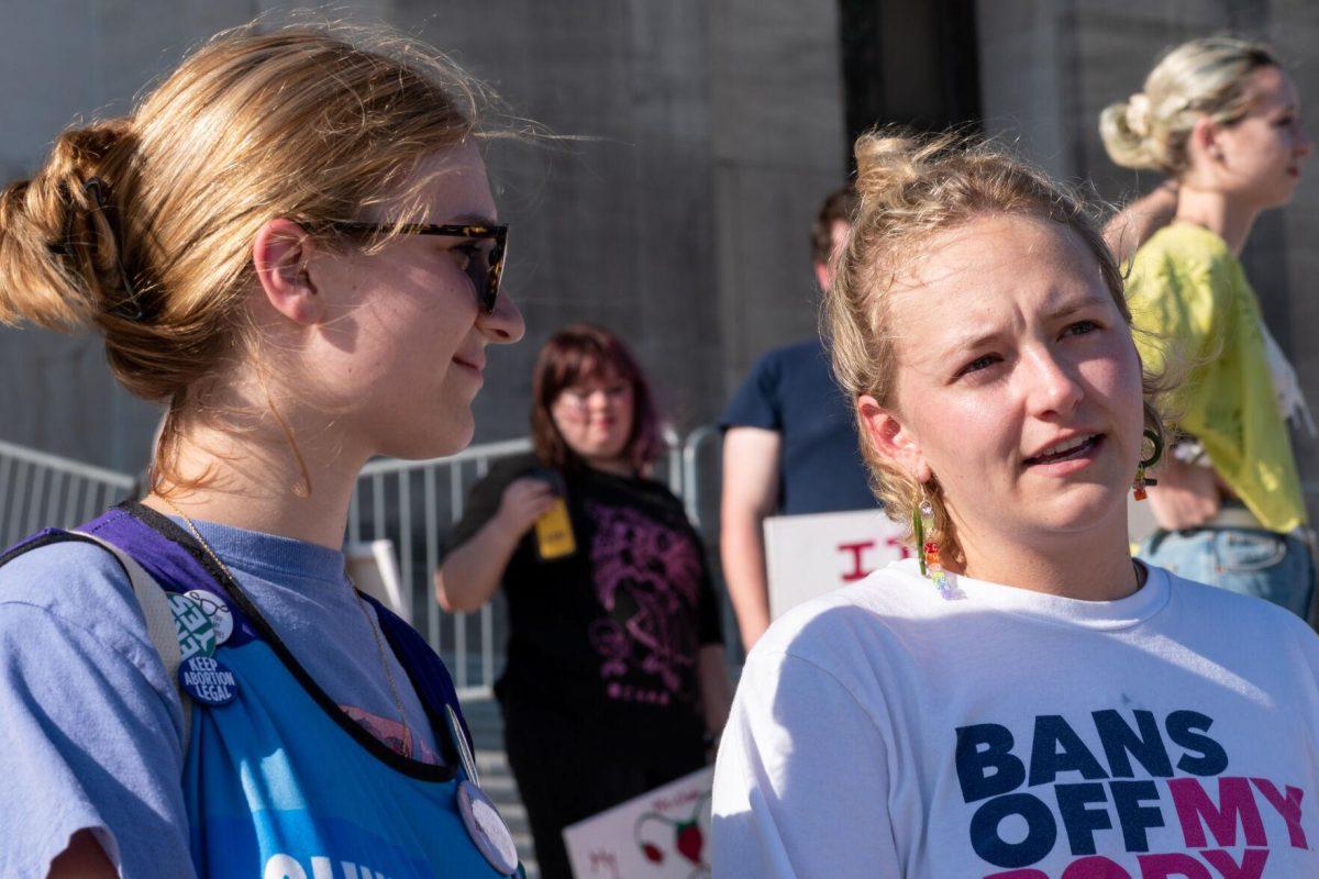 Feminists In Action officers, Kayla Meyers (left) and Gabriella Turner (right), attended the rally, May 3rd.