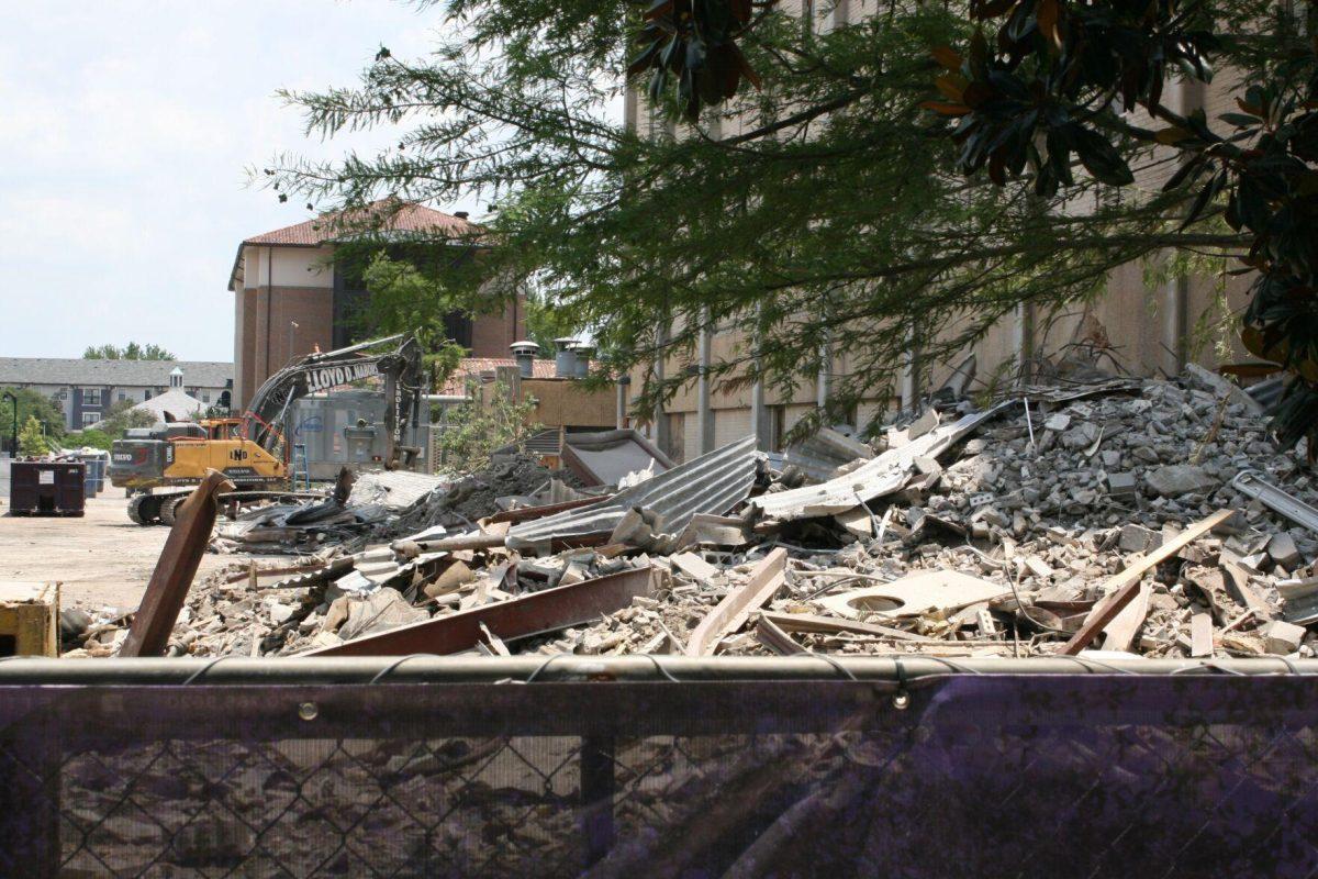 Rubble from Kirby Smith's former walls lies at the bottom of the building on Friday, May 20, 2022.