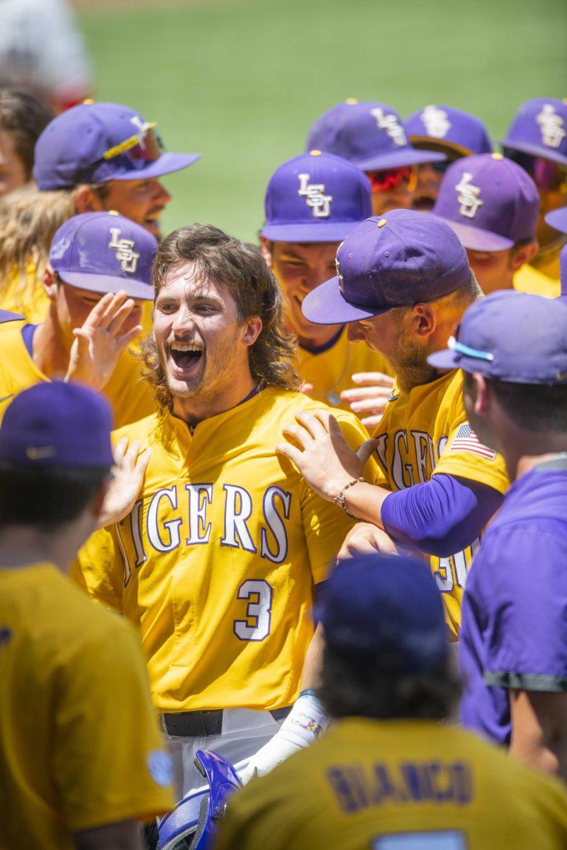 LSU baseball sophomore outfielder Dylan Crews (3) celebrates with his teammates after hitting a homerun Sunday, May, 1, 2022, during the Tigers&#8217; 4-3 walk-off win against the Georgia Bulldogs at Alex Box Stadium in Baton Rouge, La.