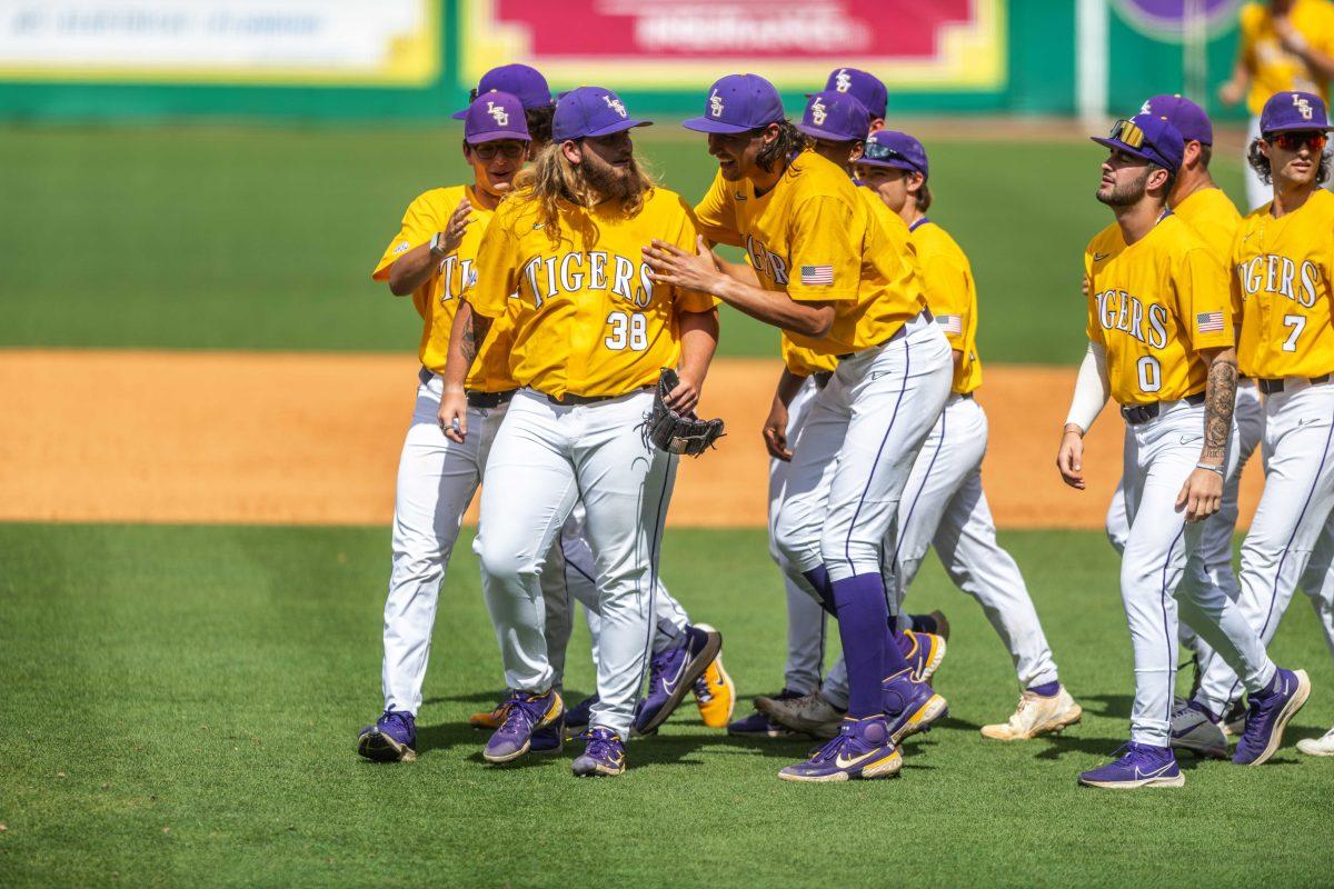 LSU baseball players surround sophomore left-handed pitcher Riley Cooper (38) Saturday, April 23, 2022, as he pitched the team to their 8-6 win over Missouri at Alex Box Stadium.