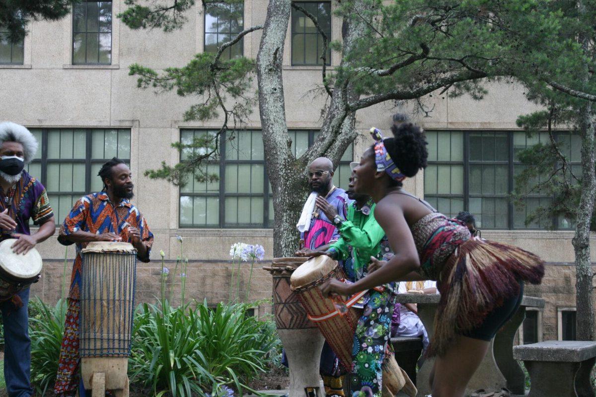 Dominique Clayton dances as&#160;Mbongi Village plays music at the Libations Ceremony on Wednesday, May 12, 2022.