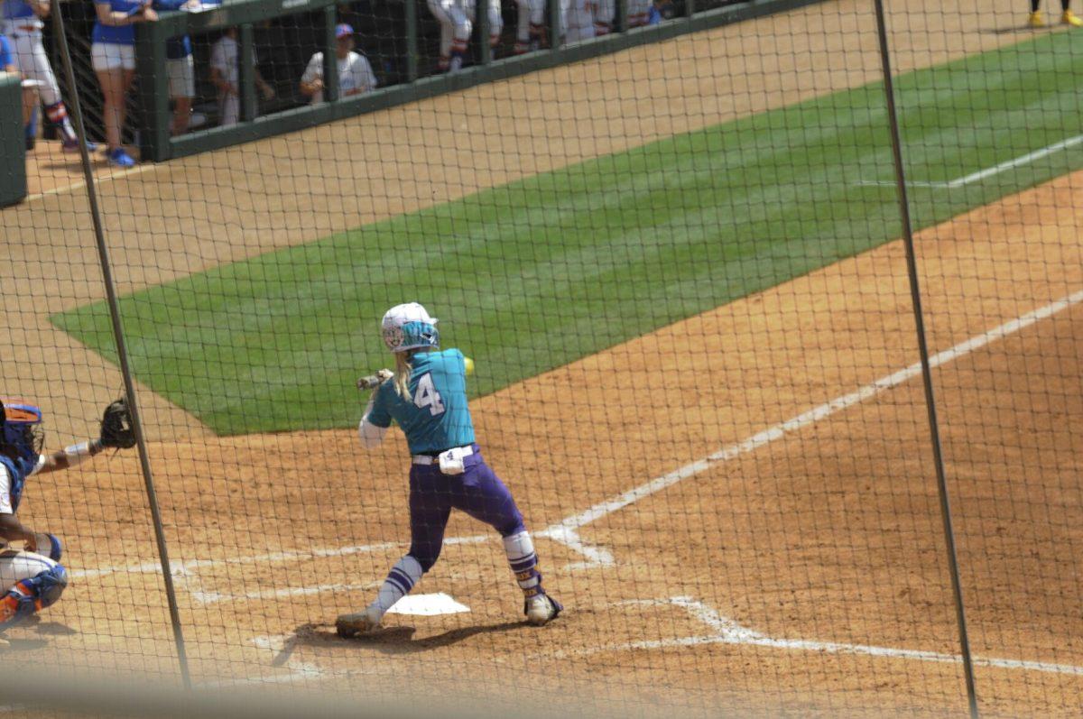 LSU freshman outfielder McKenzie Redoutey (4) swings at the pitch Saturday, April 30, 2022, during LSU&#8217;s 6-1 defeat against Florida at Tiger Park on Skip Bertman Drive in Baton Rouge, La.