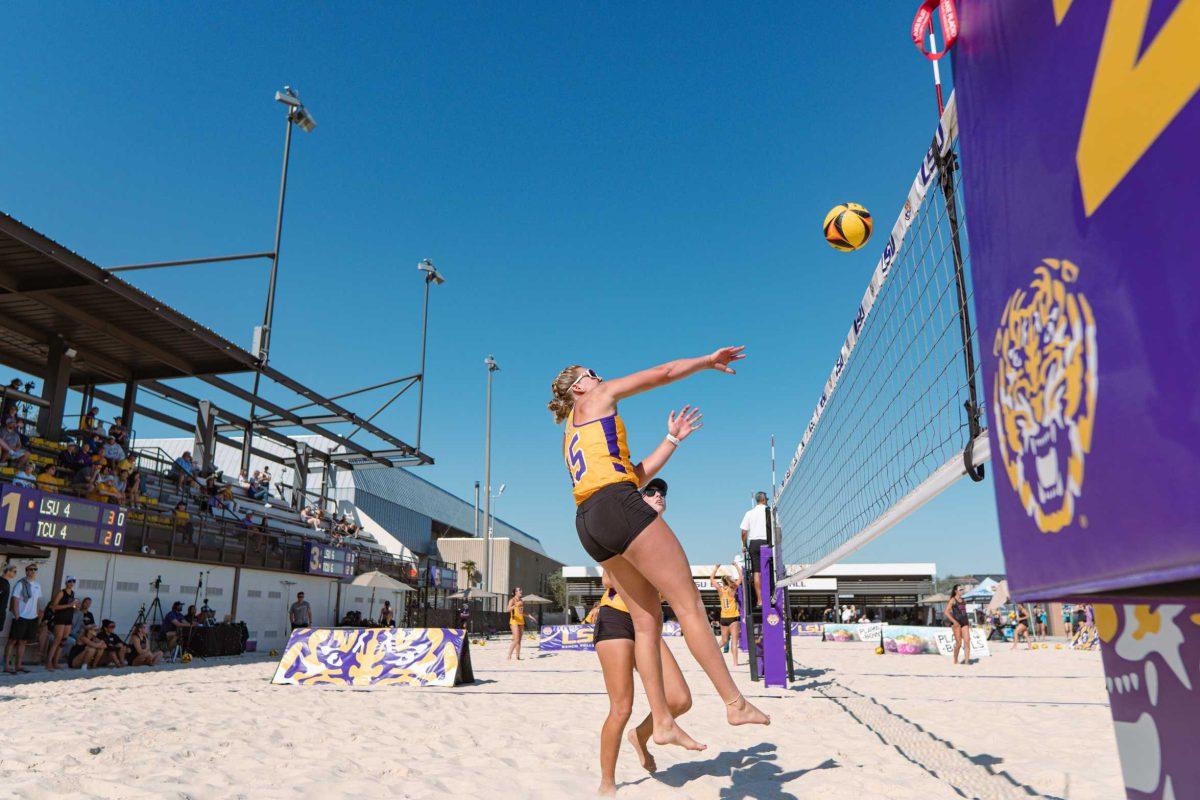 LSU beach volleyball sophomore Ellie Shank (15) hits the ball over the net on Sunday, March 27, 2022, during LSU&#8217;s 1-4 loss against TCU at the Beach Volleyball Stadium on Cypress Drive in Baton Rouge, La.