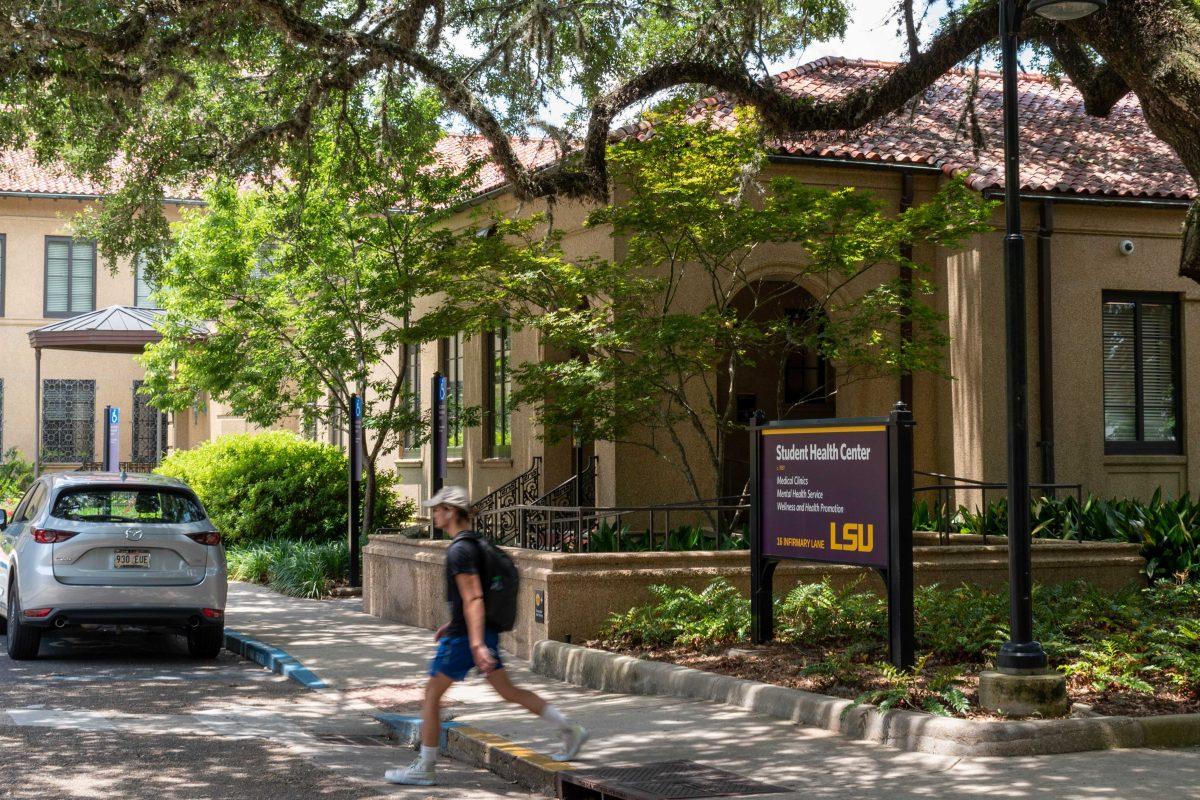 A student walks past the Student Health Center on Thursday, June 2, 2022.