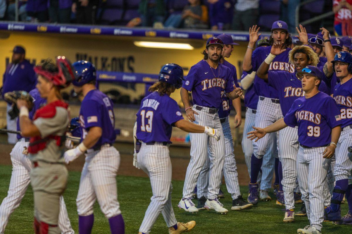 LSU baseball sophomore infield Jordan Thompson (13) celebrates a home run with his team Tuesday, April 19, 2022, against University of Louisiana Lafayette at Alex Box Stadium on Gourrier Avenue in Baton Rouge, La.