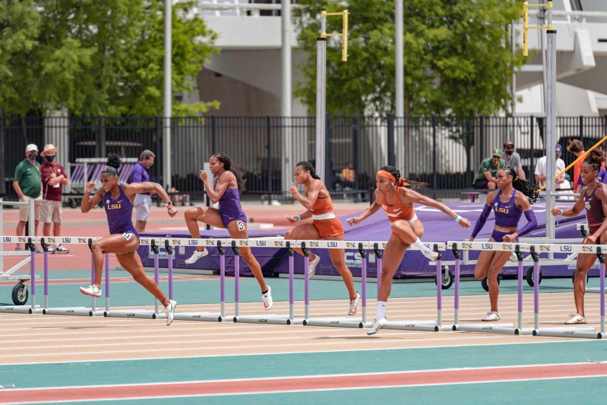 LSU track and field senior Tonea Marshall (left), senior Milan Young (center), and sophomore Alia Armstrong (right) compete in the 100-meter hurdles on April 24, 2021 at the LSU Alumni Gold meet at Bernie Moore Track Stadium on North Stadium Dr in Baton Rouge.