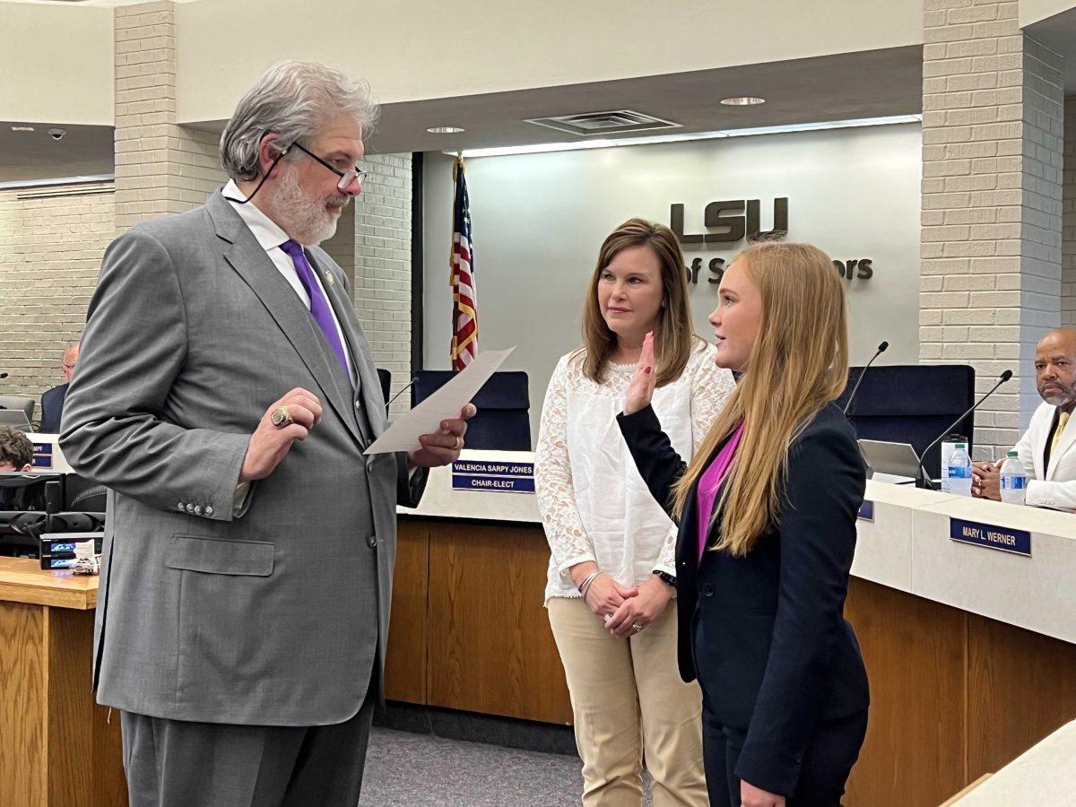 Lizzie Shaw taking her oath of office for the LSU Board of Supervisors on Thursday with Chair R&#233;my Voisin Starns.