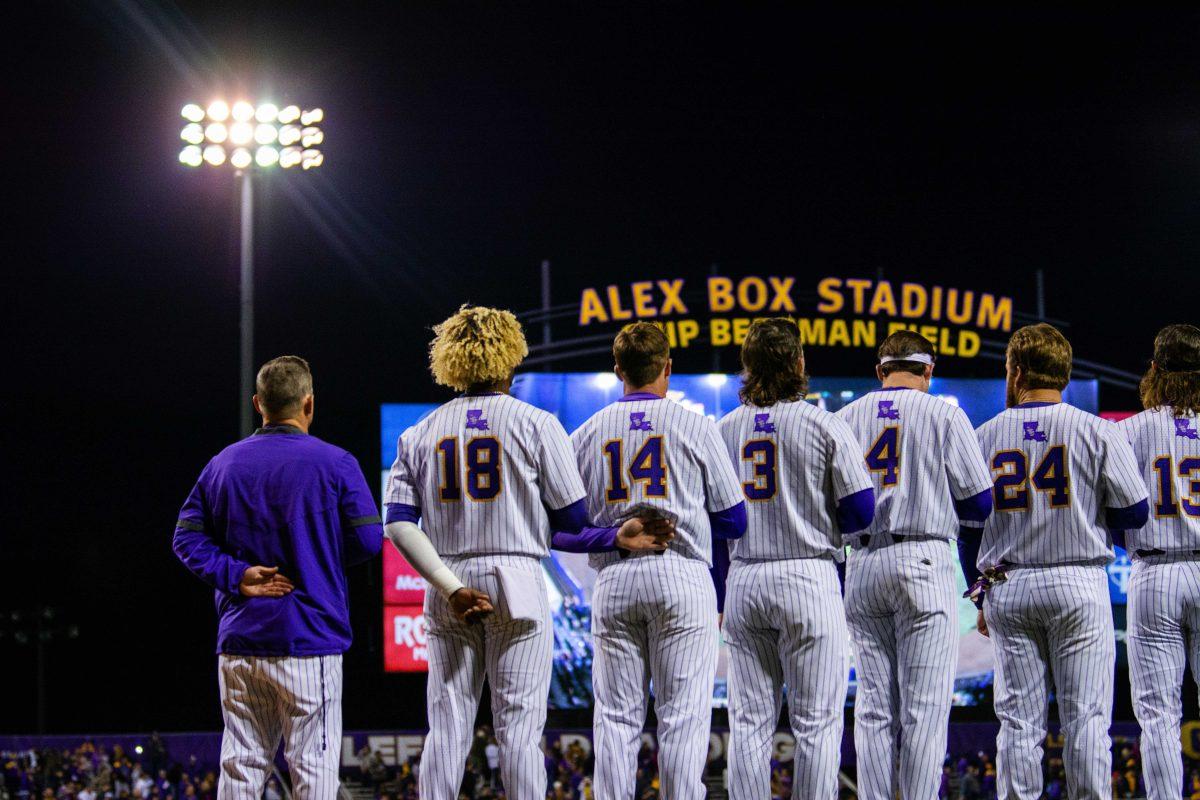 The LSU baseball team stands for the national anthem Friday, Feb. 18, 2022 before LSU's 13-1 win against Maine at Alex Box Stadium on Gourrier Avenue in Baton Rouge, La.