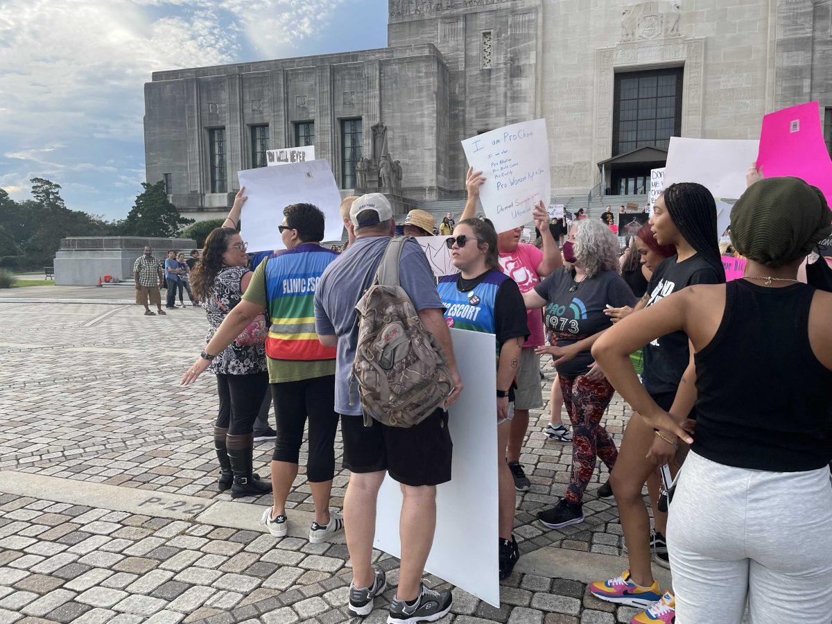 Anti-abortion protestor (wearing backpack) argue with abortion-rights protestors at an abortion-rights protest at the Louisiana State Capitol on June 30,2022