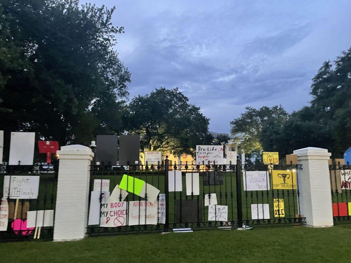 Abortion-rights protestors left their signs on the gate of the Louisiana governor's mansion on June 30, 2022